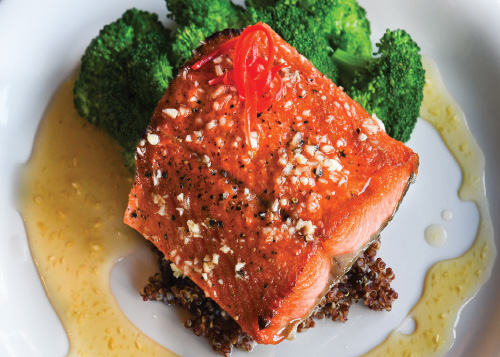 Salmon Recipes - Salmon Filet on Cutting Board with Fruit and Herbs