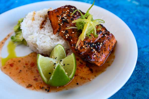 Salmon Recipes - Salmon Filet on Cutting Board with Fruit and Herbs