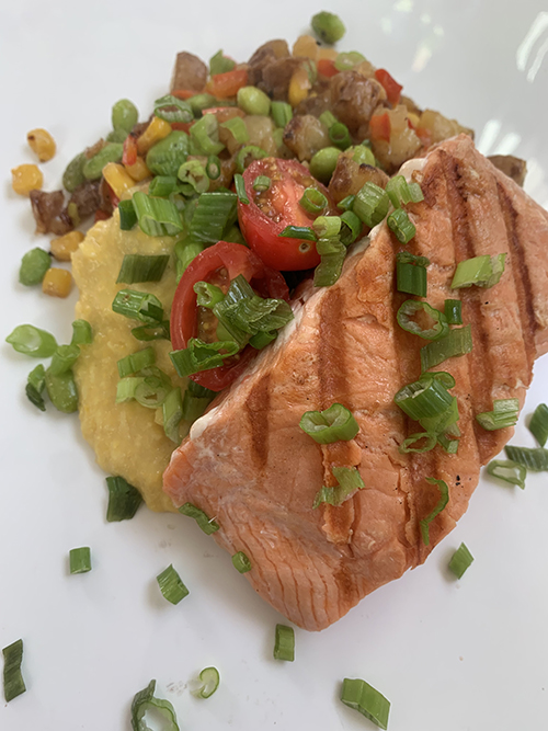 Salmon Recipes - Salmon Filet on Cutting Board with Fruit and Herbs