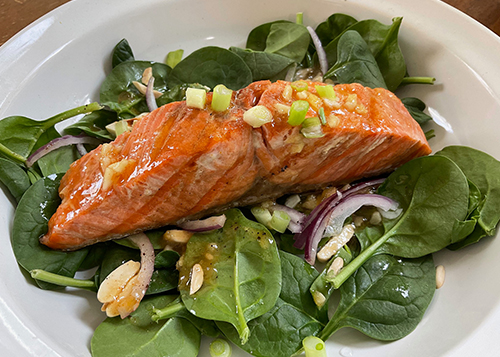 Salmon Recipes - Salmon Filet on Cutting Board with Fruit and Herbs
