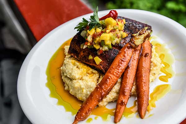 Salmon Recipes - Salmon Filet on Cutting Board with Fruit and Herbs