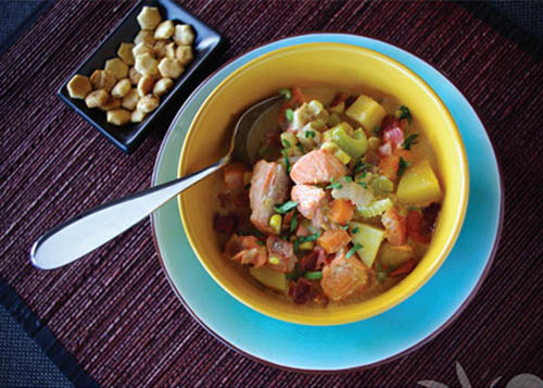 Salmon and Corn Chowder in a Bowl with Oyster Crackers