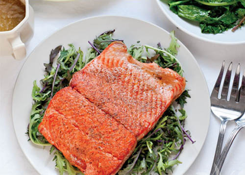 Salmon Steak Over Bed of Mixed Greens